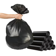 hand holding a full black bin bag beside 10 rolls of black bin bags on a white background