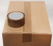 a roll of brown sealing tape resting on top of a cardboard box that has been sealed with brown tape