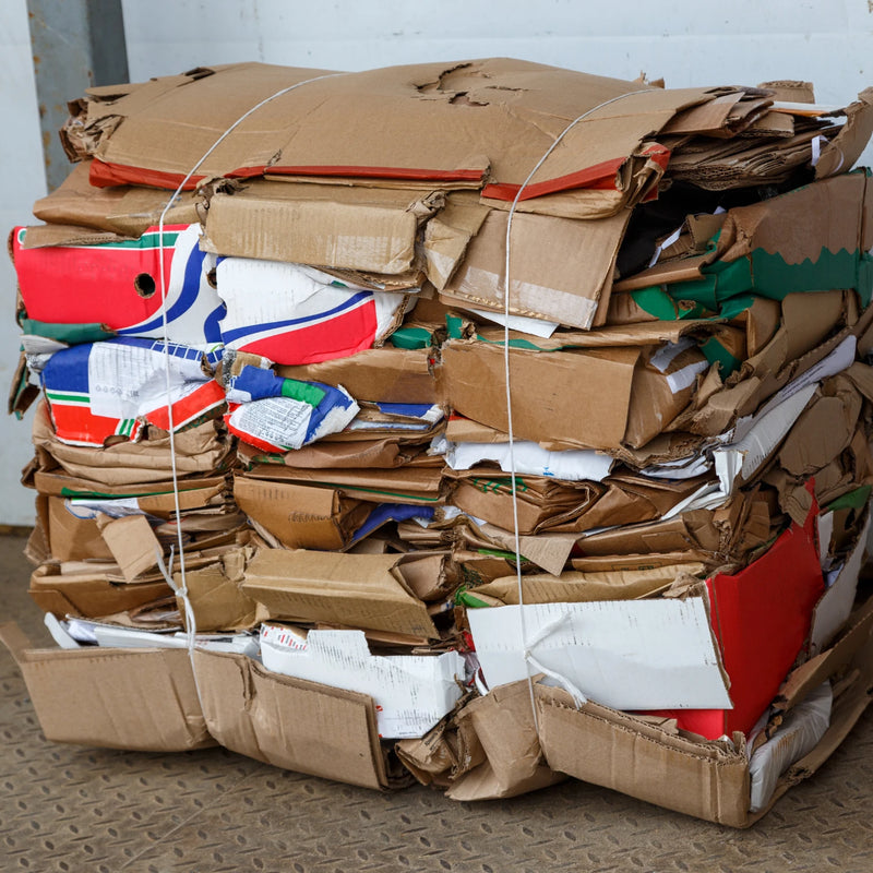 a bale of flat cardboard baled with the use of a Cardboard Baler from Box Depot