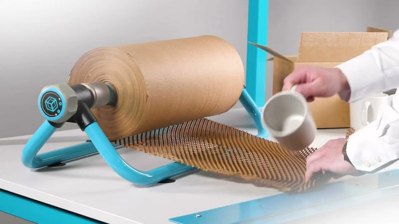 Grip Paperflex honeycomb paper on a desktop dispenser being used to wrap a mug