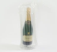 Bottle of champagne in a protective Bubl air cushioning pod on a white background