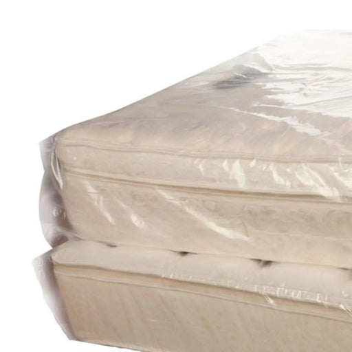 closeup of a single mattress covered with a mattress cover bag on a white background