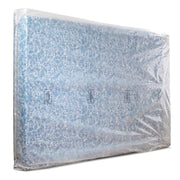 Double or superking mattress covered by a plastic mattress bag on a white bakground