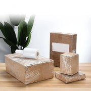 small cardboard boxes wrapped in pallet wrap with a roll of mini pallet wrap nearby