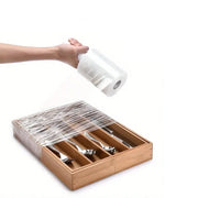 A drawer of cutlery being wrapped with mini pallet wrap in preparation for moving house
