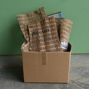 shredded cardboard matting made with a CushionPack Cardboard Shredder in a cardboard box
