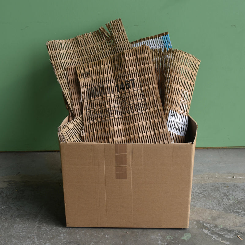 shredded cardboard matting made with a CushionPack Cardboard Shredder in a cardboard box