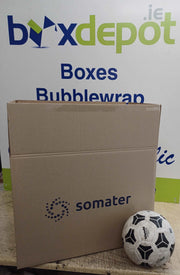 Large Double Wall Cardboard Box beside a football for size comparison in front of Box Depot advertising