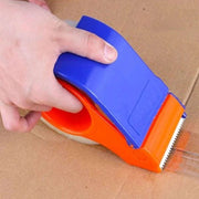 A man using a tape dispenser to apply clear tape to seal a cardboard box
