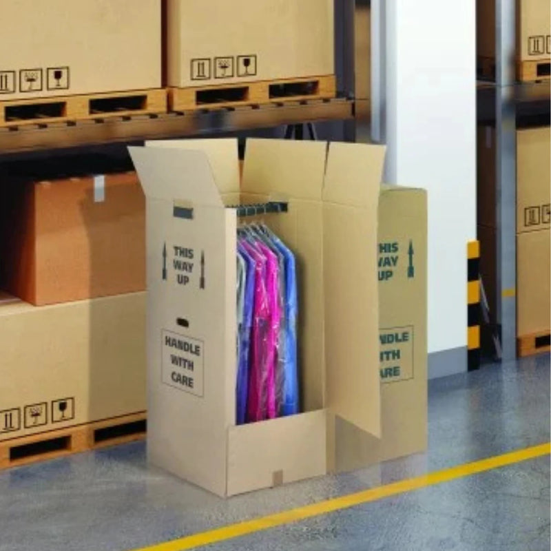 open cardboard wardrobe box full of clothes in a warehouse storage setting
