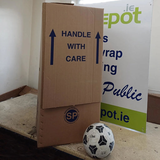 A wardrobe box beside a football to give size perspective