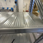 closeup of a shelf received with MetalSisteme123 boltless shelving systems in a warehouse environment