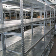 empty boltless steel shelving in a warehouse environment