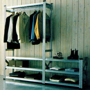 boltless steel shelving used as an open wardrobe in a home environment