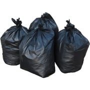 A group of four filled large black bin bags on a white background