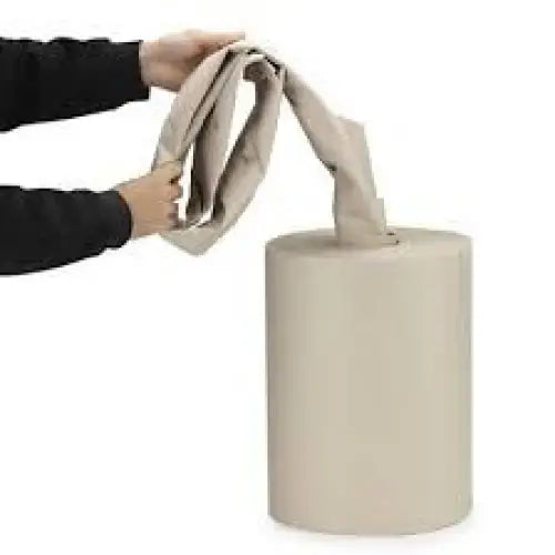 hands pulling paper voidfill packaging from a roll of voidfill on a white background