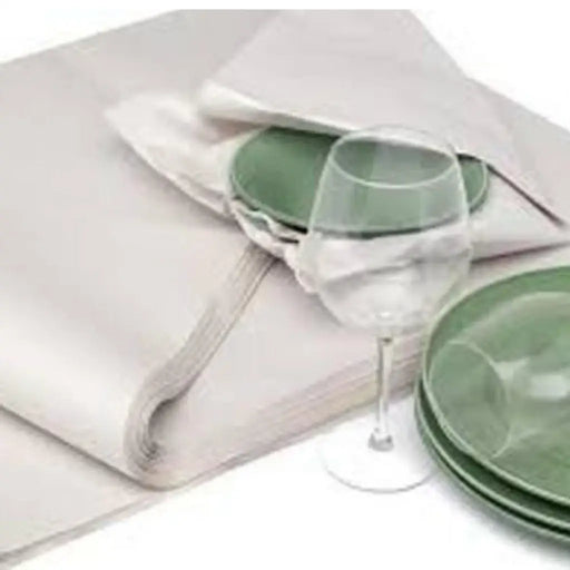 image of dishes and glasses being wrapped in white packing paper on a white background